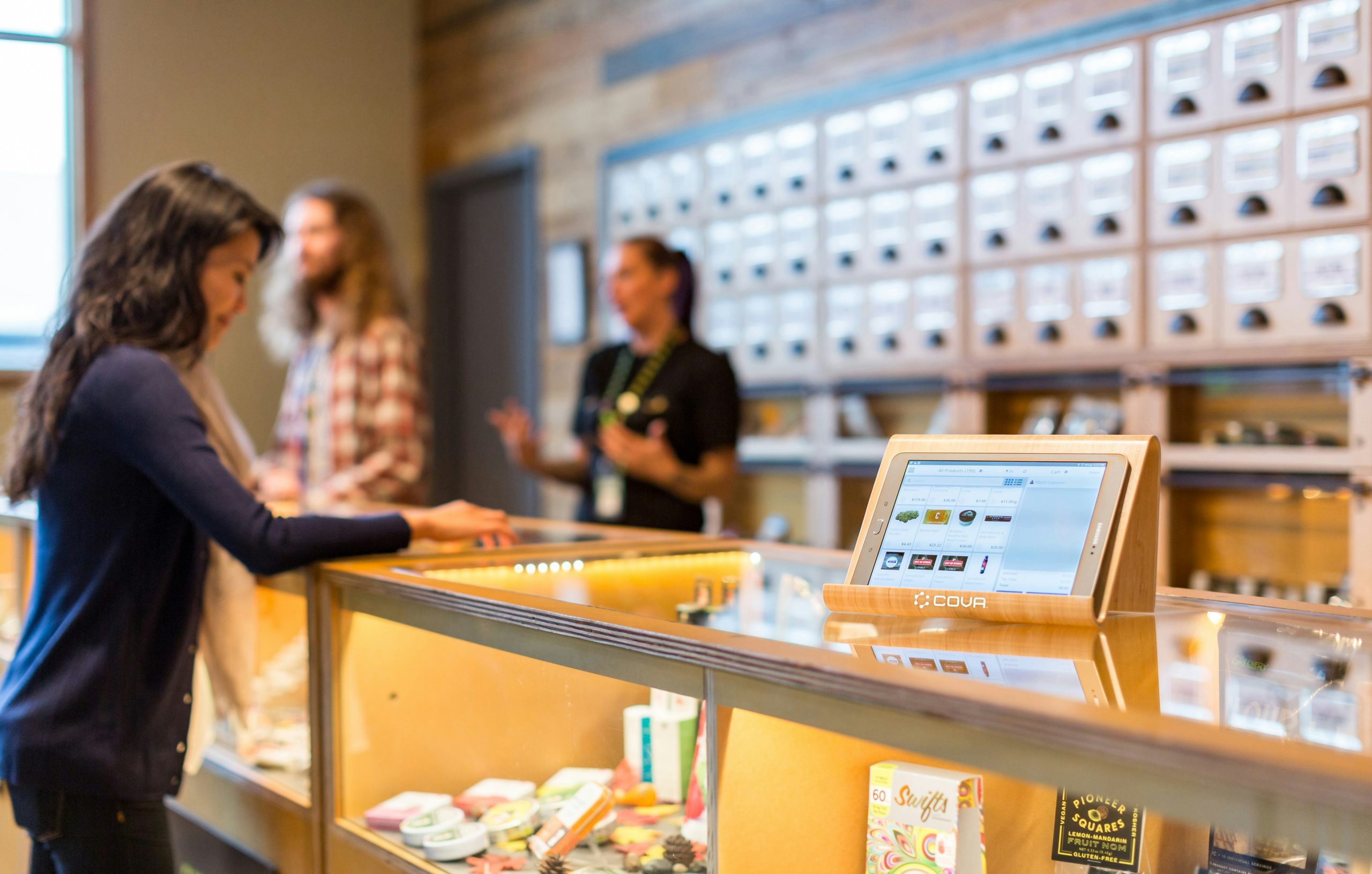 tablet sitting on top of cannabis dispensary store counter