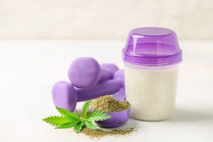 cannabis next to dumbbells